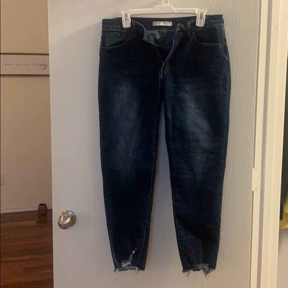 Boutique style jeans! Has fringed bottoms!
